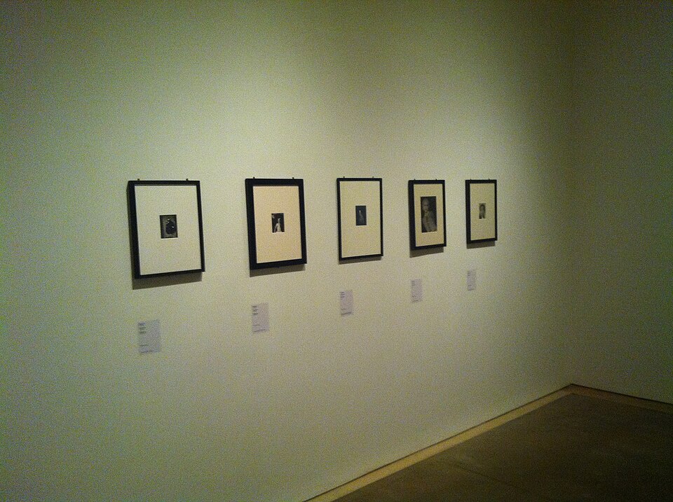 Gallery wall displaying framed Claude Cahun self-portraits at the Palau de la Virreina, Barcelona, 2012