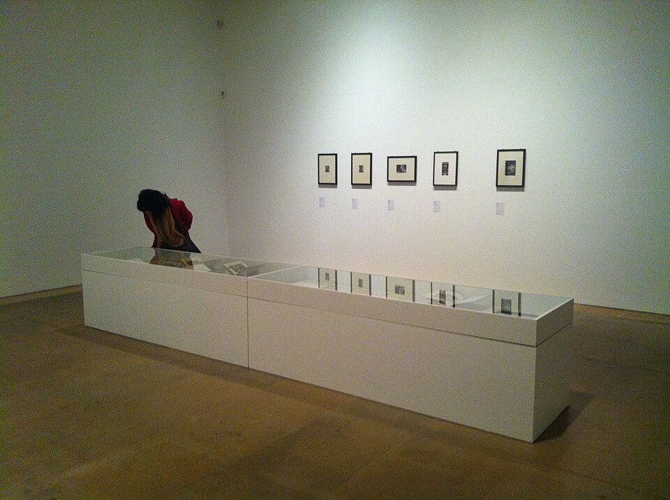 Exhibition gallery with display case and framed photographs at Claude Cahun retrospective, Palau de la Virreina, Barcelona, 2012