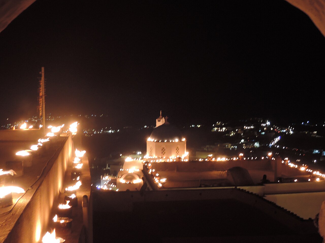 Greek Easter celebration in Pyrgos village, Santorini, echoing the village festivals and communal life in Manos's Greek Portfolio