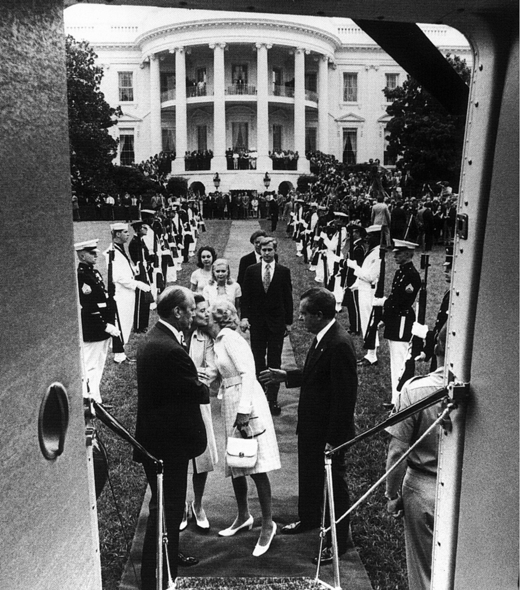 President Richard Nixon waving farewell as he departs the White House following his resignation, August 9, 1974