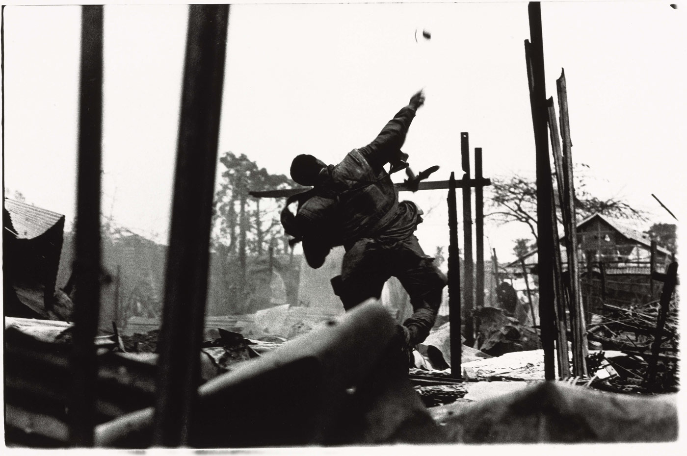 US Marine Throwing Grenade — Don McCullin, 1968