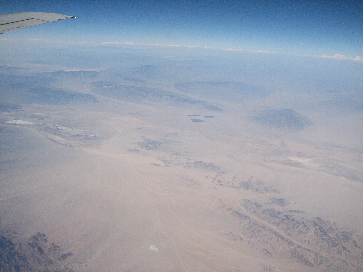 Arizona desert landscape in the style of Frederick Sommer's allover compositions