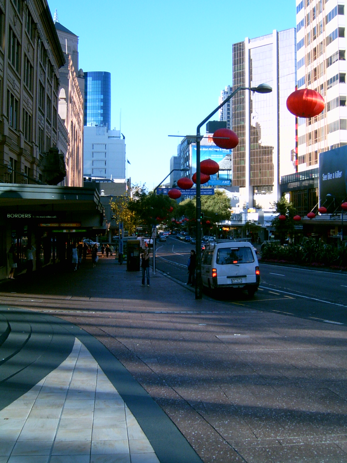 Queen Street, Auckland — urban street scene evoking the everyday observations of Harvey Benge
