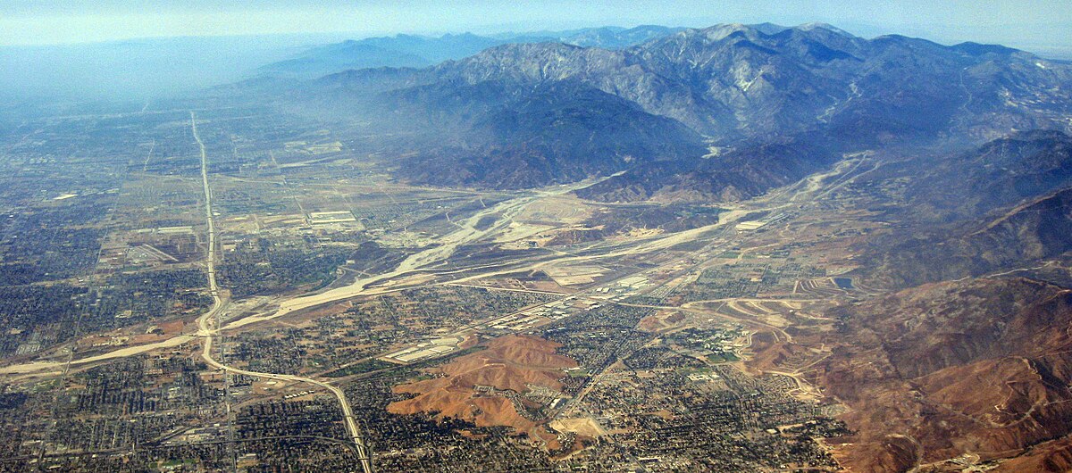 Panoramic aerial view of San Bernardino Valley with mountains and suburban development