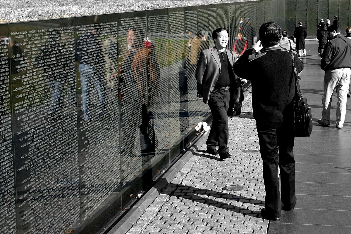 Visitor at the Vietnam Veterans Memorial wall, Washington, D.C.
