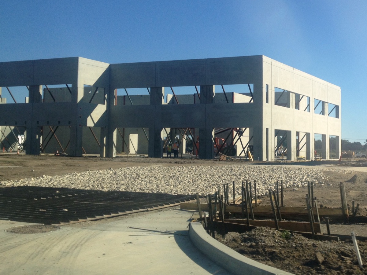 Tilt-up concrete panel construction at an industrial site, evoking Baltz's documentation of Southern California development