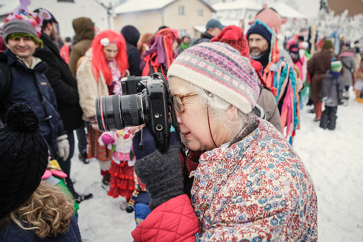 Mark&eacute;ta Luska&ccaron;ov&aacute; photographing at Masopust carnival, Roztoky, 2016