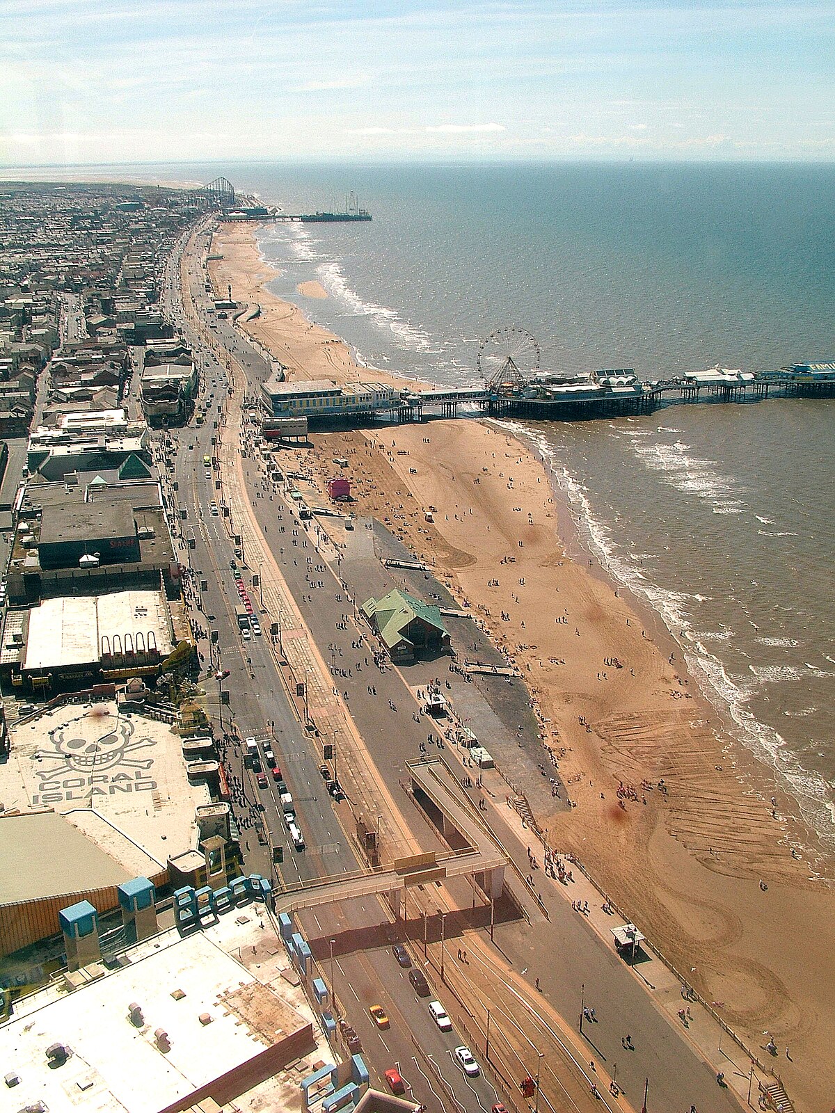 Blackpool beach and promenade with tower &mdash; reminiscent of Peter Dench's seaside documentary photography