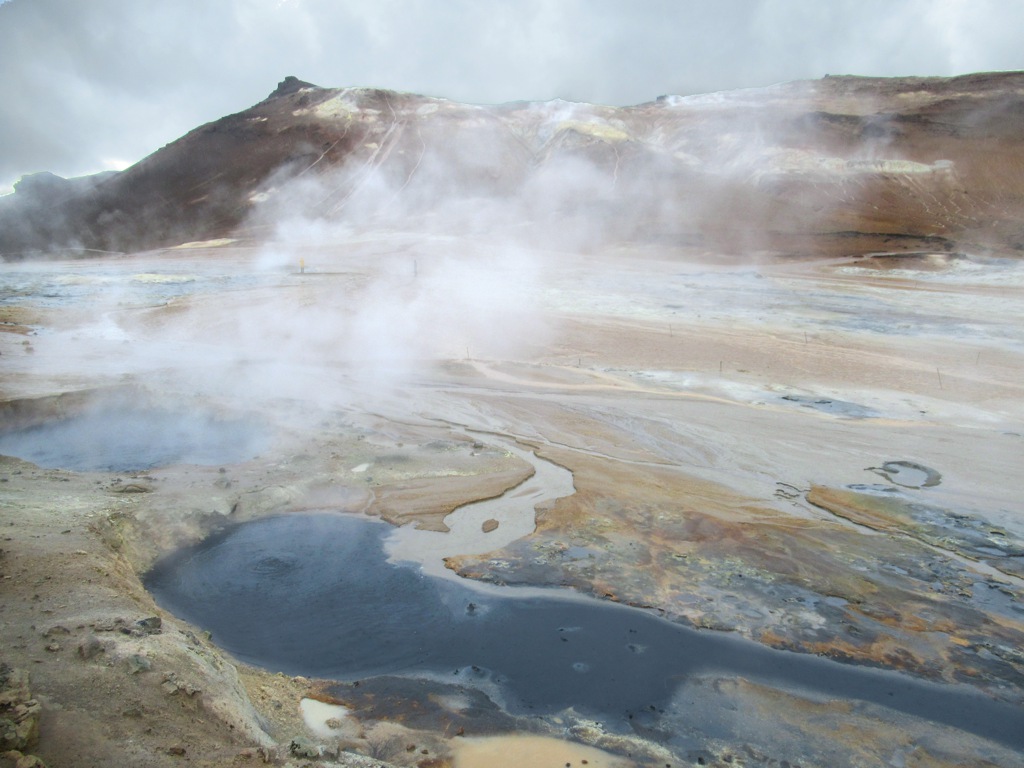 Steaming geothermal pools at Hverir, Iceland &mdash; evoking the hot spring landscapes of You Are the Weather