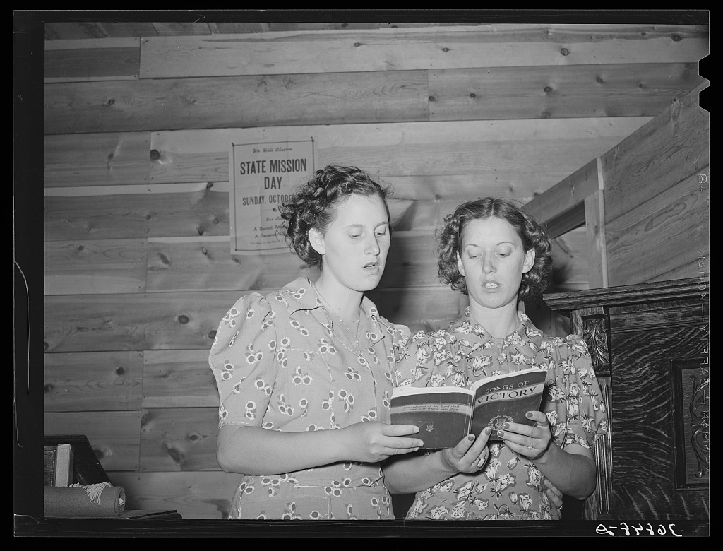 Two sisters singing a duet at the community sing, Pie Town, New Mexico, 1940 — Russell Lee, FSA/LOC