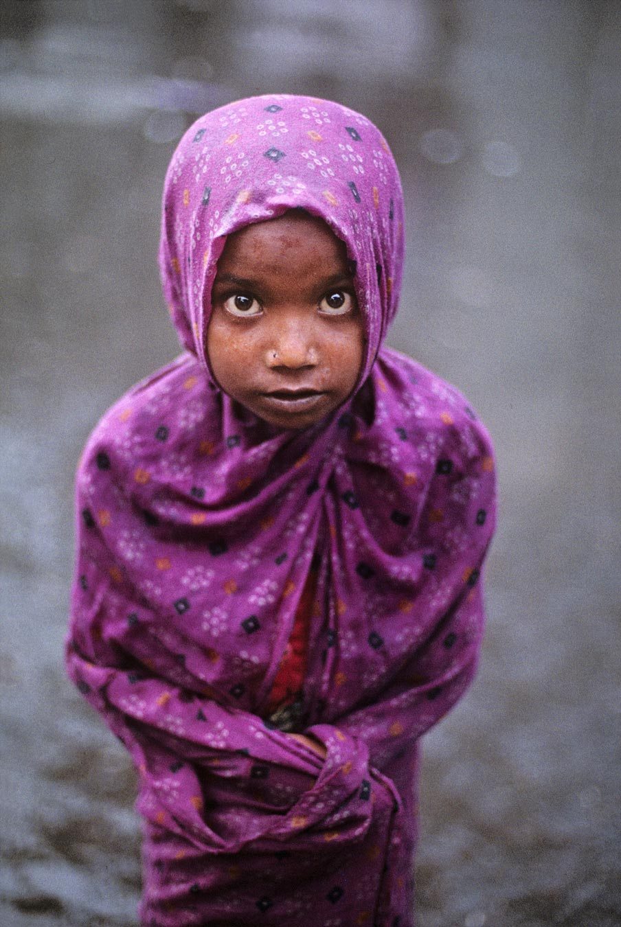 Girl in Monsoon, Bombay, India by Steve McCurry